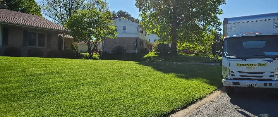 Green lawn next to work truck in Westminster, MD.