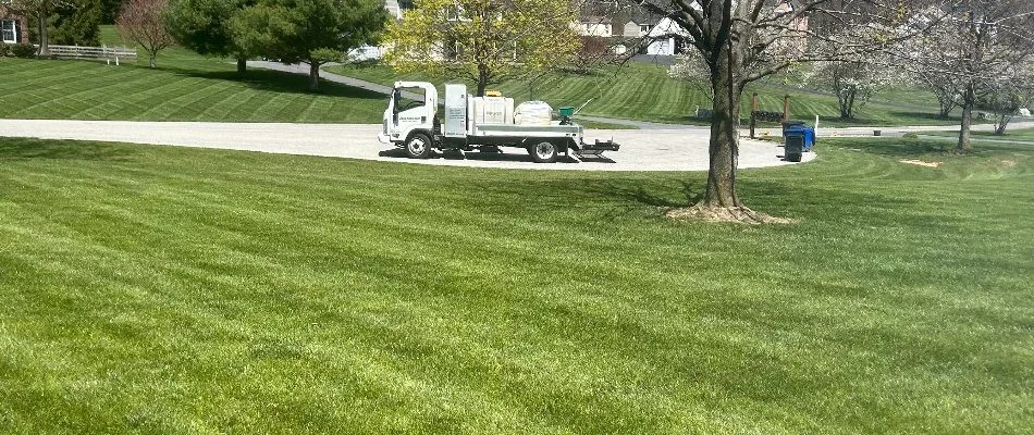 Truck next to a healthy, green lawn in Annapolis, MD.