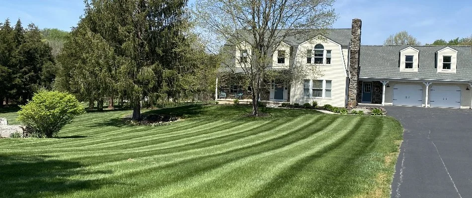 White house in Mount Airy, MD, behind a green lawn.